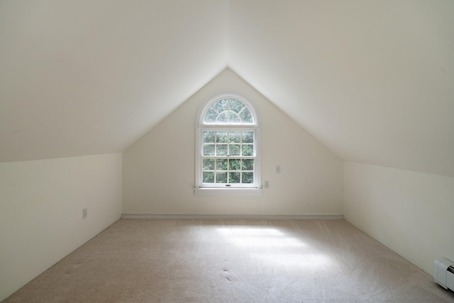1459 N Country Rd, Wading River, NY 11792 - additional living space featuring carpet floors, lofted ceiling, and a baseboard radiator