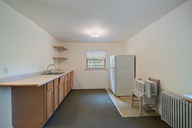 1459 N Country Rd, Wading River, NY 11792 - kitchen with radiator heating unit, freestanding refrigerator, open shelves, light countertops, and light carpet