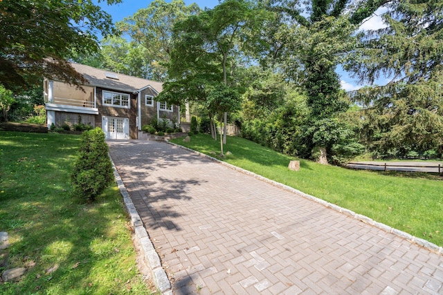 1459 N Country Rd, Wading River, NY 11792 - view of front of house with french doors, a front yard, and decorative driveway