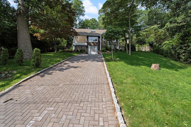 1459 N Country Rd, Wading River, NY 11792 - view of front of property featuring french doors, a front lawn, and decorative driveway