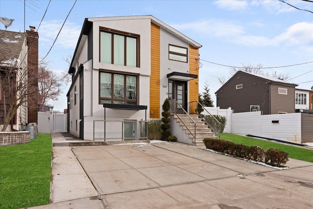 544 Oxford Rd, Cedarhurst, NY 11516 - contemporary home with a gate and stucco siding