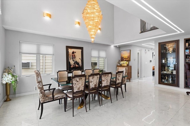 544 Oxford Rd, Cedarhurst, NY 11516 - dining space featuring a chandelier and a towering ceiling