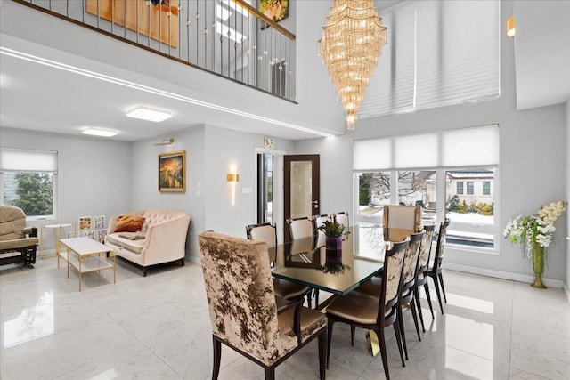 544 Oxford Rd, Cedarhurst, NY 11516 - dining space with a chandelier and a towering ceiling