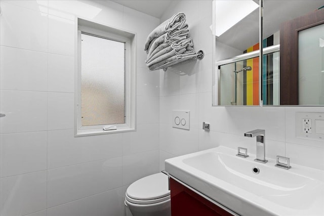 544 Oxford Rd, Cedarhurst, NY 11516 - bathroom with tile walls, vanity, and a stall shower