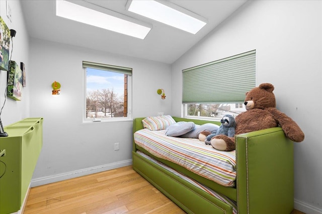 544 Oxford Rd, Cedarhurst, NY 11516 - bedroom with light wood-style flooring and vaulted ceiling