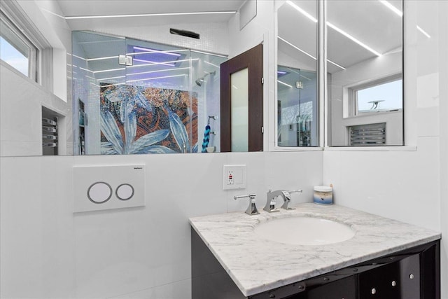 544 Oxford Rd, Cedarhurst, NY 11516 - full bath with vanity, a shower, and healthy amount of natural light