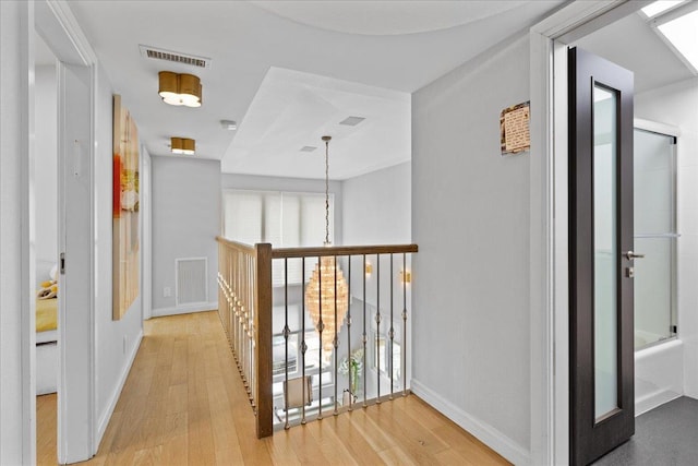 544 Oxford Rd, Cedarhurst, NY 11516 - hall with wood finished floors and healthy amount of natural light