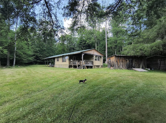 113 Lake Muskoday Rd, Roscoe, NY 12776 - view of grassy yard featuring a storage shed and a deck