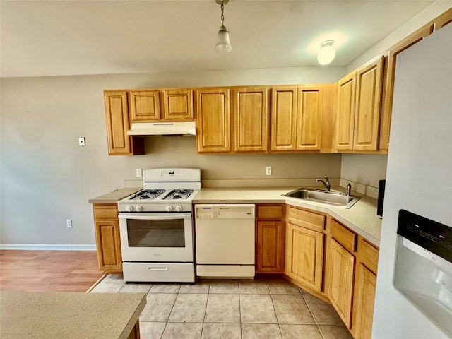 71 Jordan Ln, Middletown, NY 10940 - kitchen featuring white appliances, under cabinet range hood, light countertops, decorative light fixtures, and light tile patterned floors