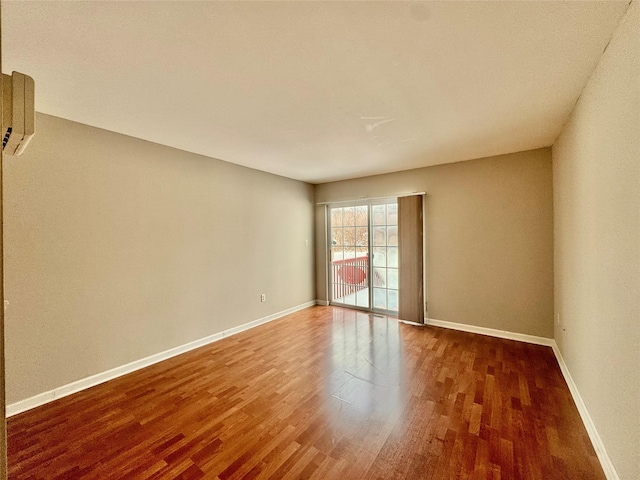 71 Jordan Ln, Middletown, NY 10940 - empty room with wood finished floors and an AC wall unit