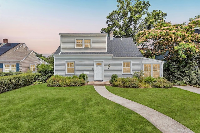 63 Old Farm Rd, Levittown, NY 11756 - view of front of property featuring a yard, a chimney, and roof with shingles