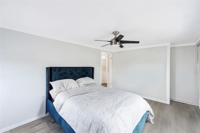 63 Old Farm Rd, Levittown, NY 11756 - bedroom featuring wood finished floors, a ceiling fan, and ornamental molding
