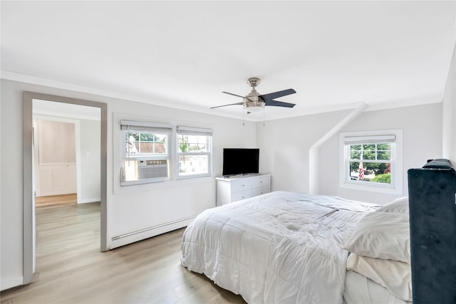 63 Old Farm Rd, Levittown, NY 11756 - bedroom with a baseboard heating unit, light wood finished floors, cooling unit, ornamental molding, and ceiling fan