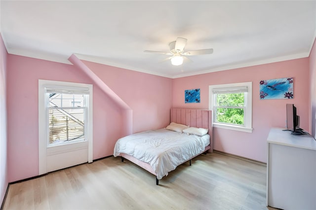 63 Old Farm Rd, Levittown, NY 11756 - bedroom with light wood finished floors and a ceiling fan