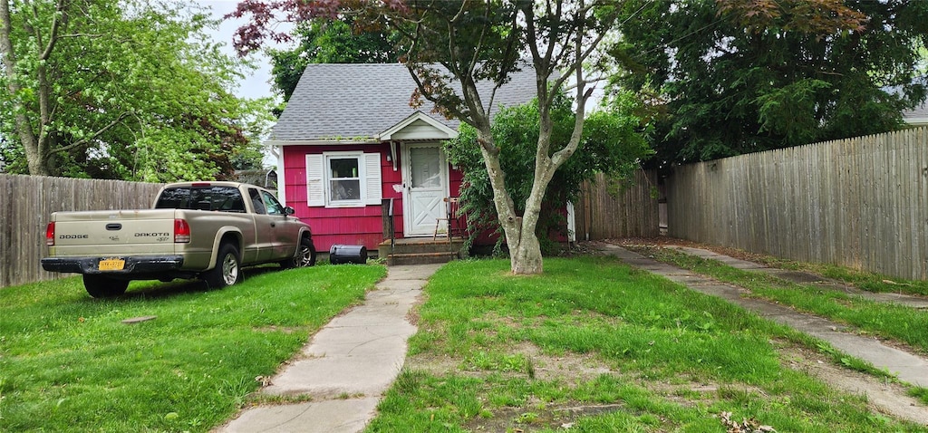 202 Forest Rd W, Mastic Beach, NY 11951 - view of front of house featuring roof with shingles and entry steps