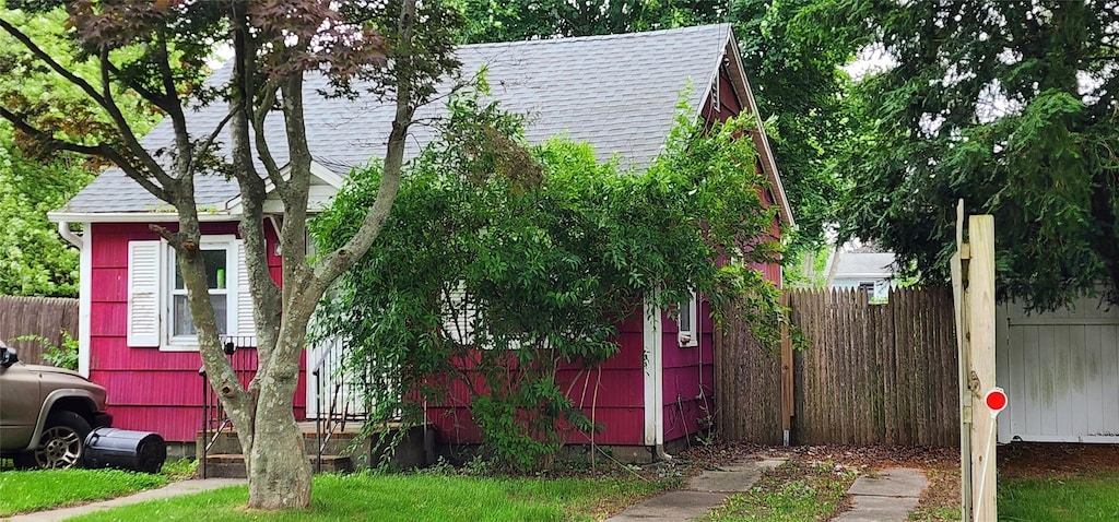 202 Forest Rd W, Mastic Beach, NY 11951 - view of property exterior featuring roof with shingles