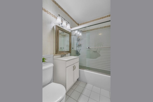 345 E 93rd St Unit 2E, New York Manhattan, NY 10128 - bathroom featuring vanity, tile patterned flooring, enclosed tub / shower combo, and tile walls