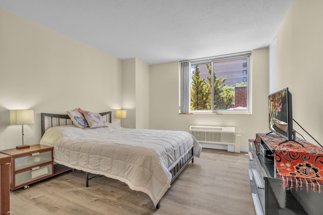 345 E 93rd St Unit 2E, New York Manhattan, NY 10128 - bedroom with light wood finished floors and an AC wall unit