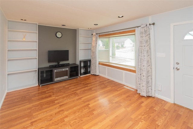31 Peter Cooper Dr, Hyde Park, NY 12601 - unfurnished living room featuring light wood finished floors and baseboards