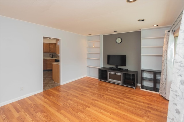 31 Peter Cooper Dr, Hyde Park, NY 12601 - unfurnished living room with light wood-style floors, recessed lighting, and built in features