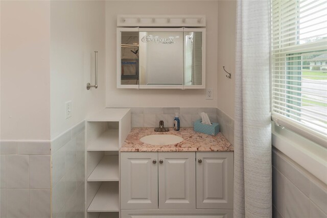 31 Peter Cooper Dr, Hyde Park, NY 12601 - bathroom featuring tile walls, vanity, and wainscoting