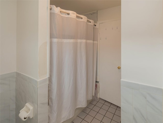 31 Peter Cooper Dr, Hyde Park, NY 12601 - bathroom featuring wainscoting, curtained shower, tile patterned flooring, and tile walls