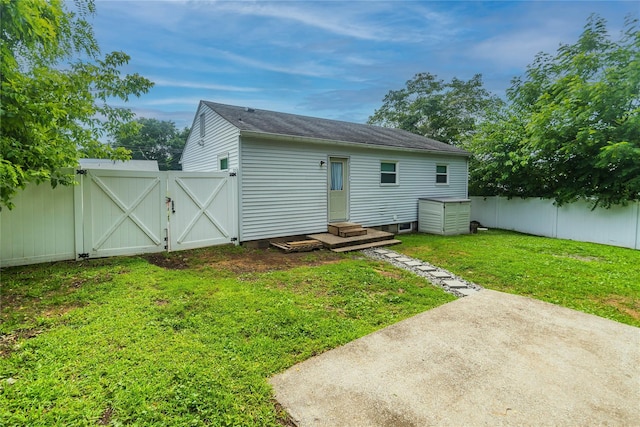 31 Peter Cooper Dr, Hyde Park, NY 12601 - rear view of house with a gate, a fenced backyard, a patio area, entry steps, and a shingled roof