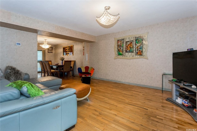 110-17 64th Ave, Forest Hills, NY 11375 - living area featuring a chandelier, light wood-type flooring, and wallpapered walls