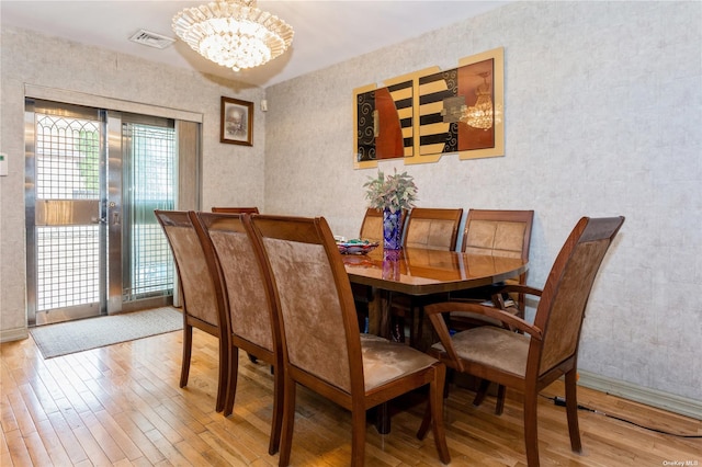 110-17 64th Ave, Forest Hills, NY 11375 - dining area featuring hardwood / wood-style flooring and a chandelier