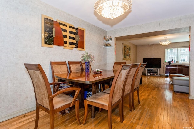 110-17 64th Ave, Forest Hills, NY 11375 - dining area featuring a chandelier, hardwood / wood-style flooring, and wallpapered walls