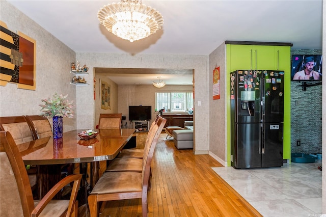 110-17 64th Ave, Forest Hills, NY 11375 - dining room featuring a chandelier and light wood-style flooring