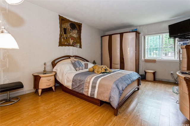 110-17 64th Ave, Forest Hills, NY 11375 - bedroom with light wood-style flooring