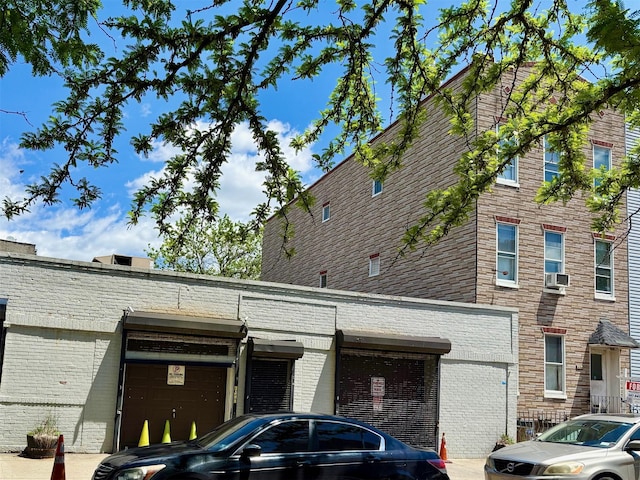 7313 71st St, Ridgewood, NY 11385 - view of property with an attached garage