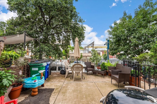 51-17 47th St Unit 2, Woodside, NY 11377 - view of patio with an outdoor living space and outdoor dining space