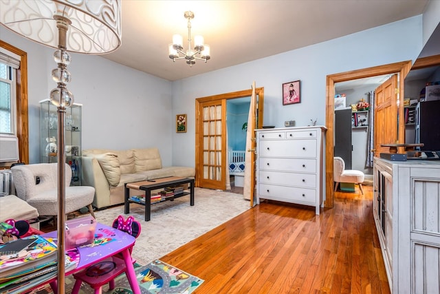 51-17 47th St Unit 2, Woodside, NY 11377 - living area with a chandelier and hardwood / wood-style floors