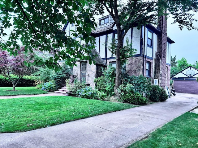 3345 160th St, Flushing, NY 11358 - view of home's exterior featuring an outdoor structure, a chimney, a yard, a garage, and brick siding