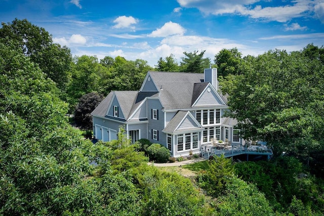 90 River Rd, Hyde Park, NY 12538 - rear view of house with a chimney, a garage, and a wooden deck