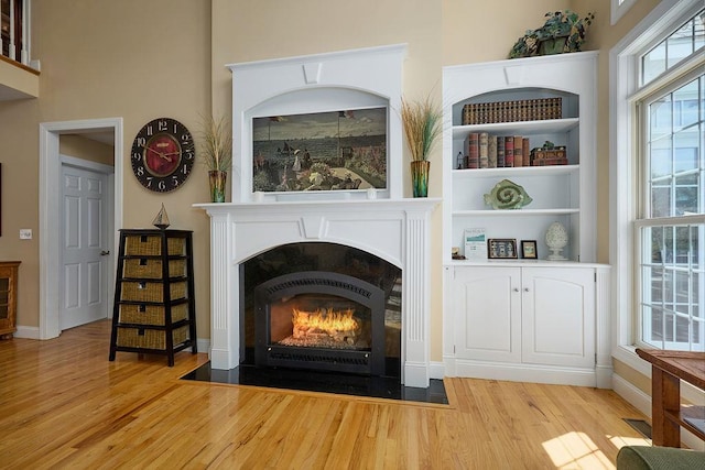 90 River Rd, Hyde Park, NY 12538 - detailed view of wood finished floors and a fireplace with flush hearth