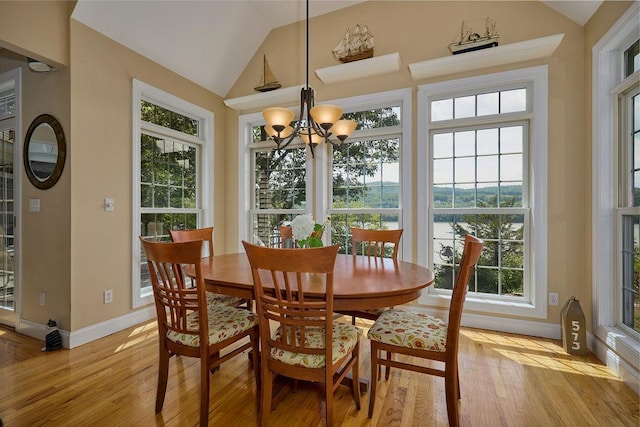90 River Rd, Hyde Park, NY 12538 - dining area with lofted ceiling, light wood finished floors, and a chandelier