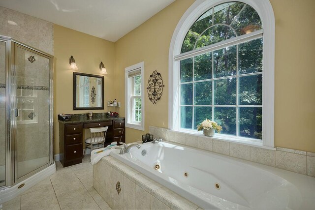 90 River Rd, Hyde Park, NY 12538 - full bath featuring a stall shower, a whirlpool tub, vanity, and tile patterned flooring