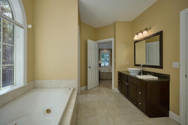 90 River Rd, Hyde Park, NY 12538 - ensuite bathroom featuring a whirlpool tub, double vanity, and tile patterned floors