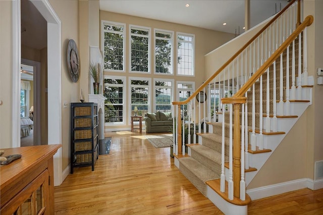 90 River Rd, Hyde Park, NY 12538 - foyer with light wood-type flooring, stairway, recessed lighting, and a high ceiling