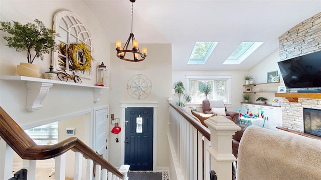114 Shetland Dr, New City, NY 10956 - entrance foyer with a fireplace, a chandelier, a skylight, and high vaulted ceiling