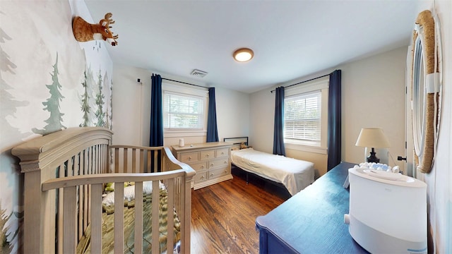 114 Shetland Dr, New City, NY 10956 - bedroom with multiple windows and dark wood-style flooring