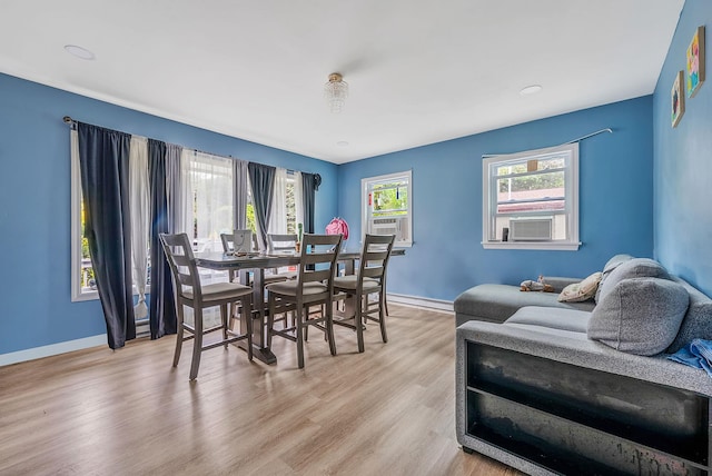 299 Orchid Dr, Mastic Beach, NY 11951 - dining area featuring light wood-style floors and cooling unit