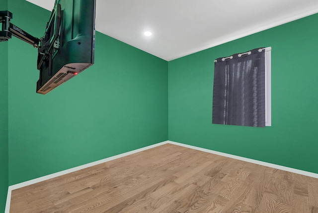 299 Orchid Dr, Mastic Beach, NY 11951 - empty room with wood finished floors and recessed lighting