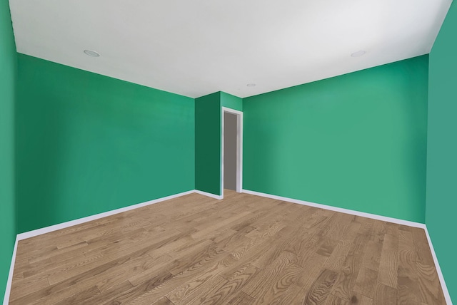 299 Orchid Dr, Mastic Beach, NY 11951 - spare room with wood finished floors and baseboards