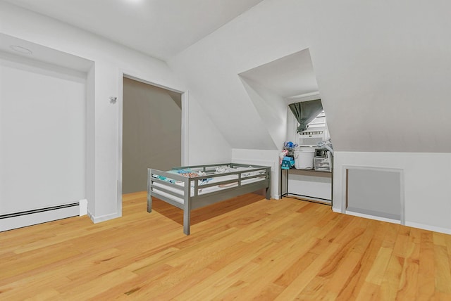 299 Orchid Dr, Mastic Beach, NY 11951 - additional living space featuring wood finished floors and baseboard heating