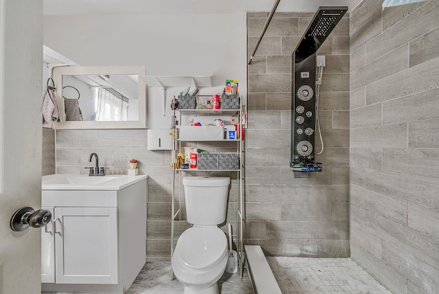 299 Orchid Dr, Mastic Beach, NY 11951 - full bathroom with vanity, tiled shower, and tile walls