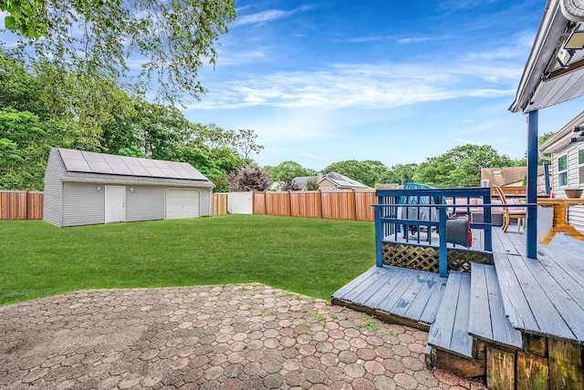 299 Orchid Dr, Mastic Beach, NY 11951 - fenced backyard with a deck, an outbuilding, and a patio